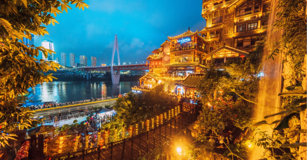 a photo of Bridge Capital of China and hongya cave in chongqing lit up at night